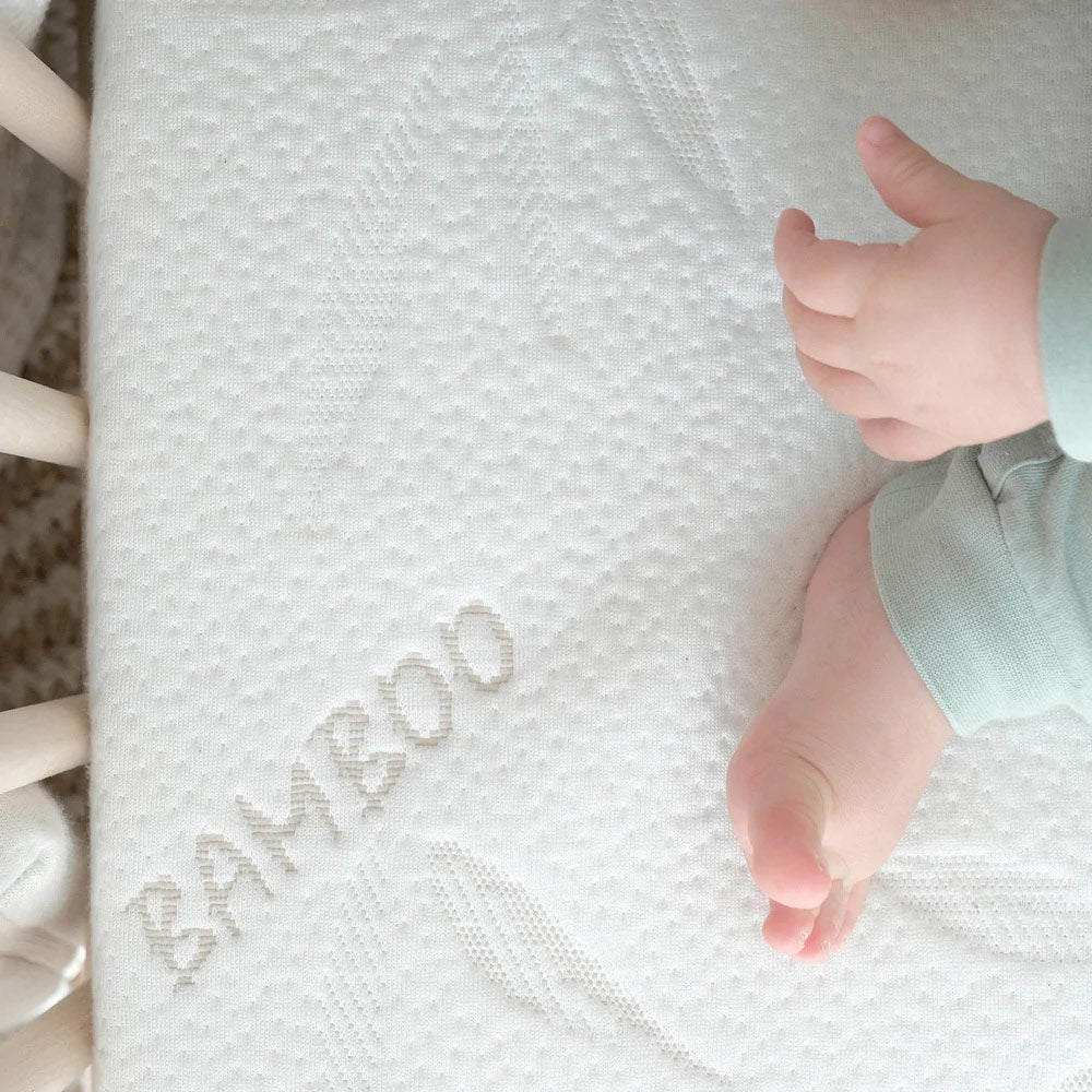 Newborn cot mattress top